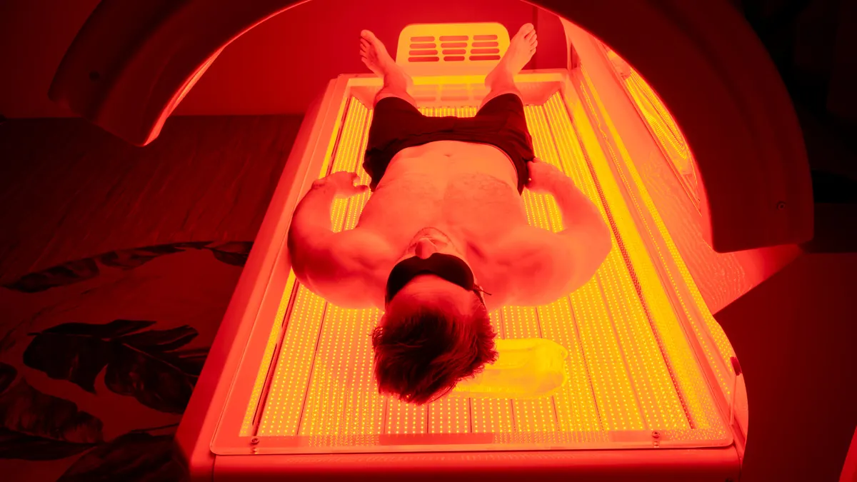 Person receiving full-body red and near-infrared light exposure inside the Mito Prime bed